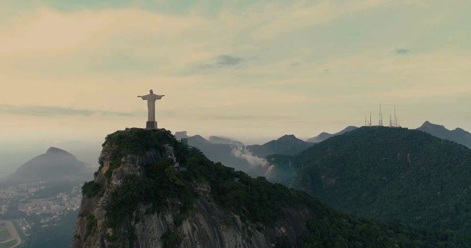 Aerial morning View Of Christ The Redeemer Statue at sunrise. Rio de Janeiro, Brazil