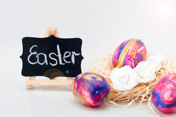 Easter eggs are painted and made in the technique of decoupage. Chicken and nest. Inscription Easter. Free space for text.	