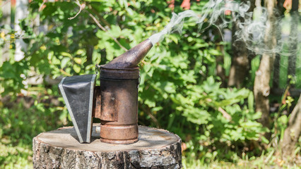 Smoker,beekeeping equipment to pacify the bees.
