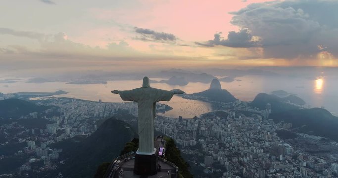 Aerial View Of Christ The Redeemer Statue and Botafogo Bay at sunrise. Rio de Janeiro, Brazil