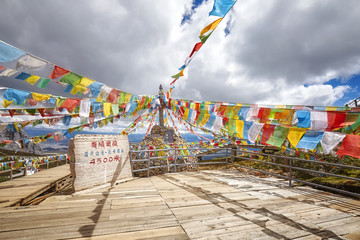 Top of the Shika Snow Mountain Scenic Area (4500 meters above the sea level) with Buddhist prayer flags, China