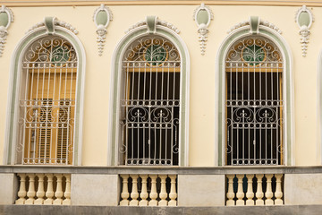 Fototapeta na wymiar Typical Cuban palace window with iron protection grate