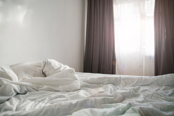 morning concept sunlight from the window on empty bed