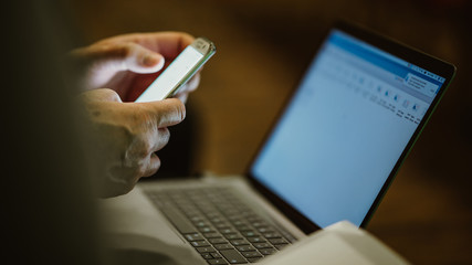 Computer and cellphone in meeting