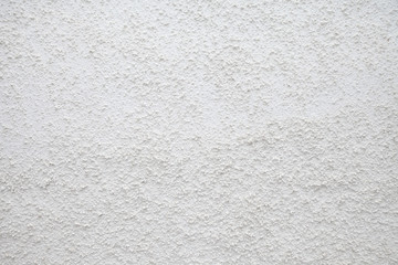 Close-up of white painted grungy concrete wall with texture. Сoncrete plaster with refined modern industrial textural effect.