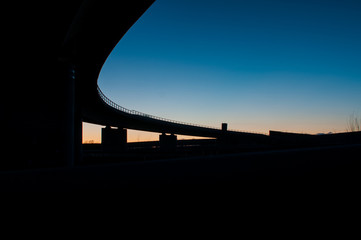 Traffic autobahn bridge at sunset
