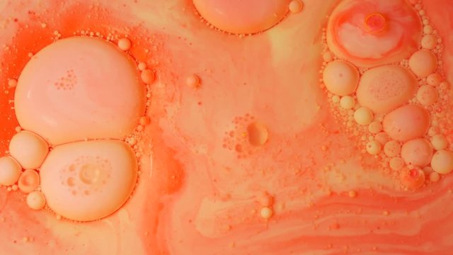 Ink Bubbles In Water. Orange Bubbles.Bright Collors Bubbles Oil Beautiful Paint Surface Red And Yellow Universe Of Color Moving Multicolored Macro.