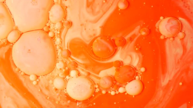 Ink Bubbles In Water. Orange Bubbles.Bright Collors Bubbles Oil Beautiful Paint Surface Red And Yellow Universe Of Color Moving Multicolored Macro.