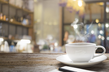 Wooden table with blur background of coffee shop