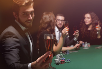 poker player with a glass of wine