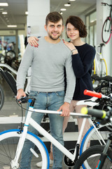Fototapeta na wymiar man and female standing with bicycle