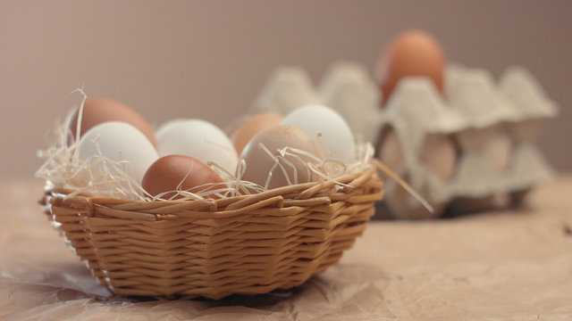 different eggs in basket. Small farm eco eggs