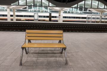 Fototapeta na wymiar wooden seat at the train station