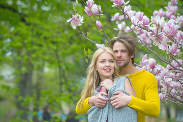 woman with bearded man at magnolia tree