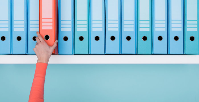 Office Worker Taking A Folder In The Archive