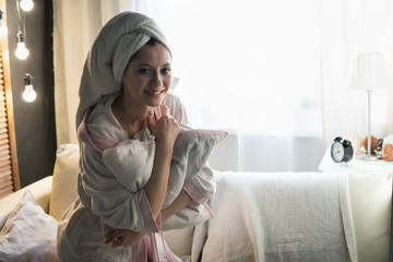 woman in a house dressing gown and with a towel