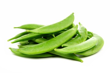 Pile of fresh snap peas. Side view isolated on a white background.