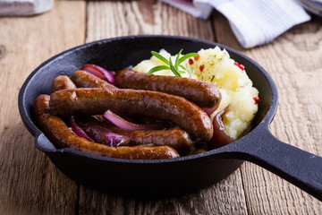 Sausage and onion casserole with potato mash