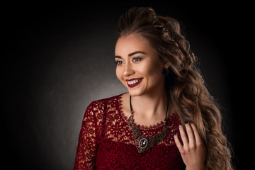 Charming young girl with beautiful curly hairstyle