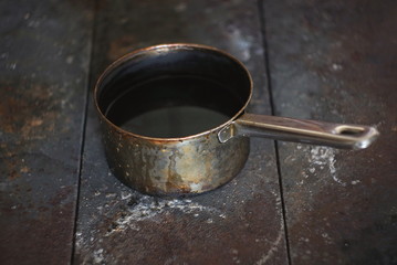 an old metal vessel in an old rural kitchen