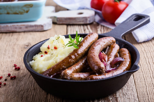 Sausage and onion casserole with potato mash