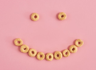 Cereals on pink background
