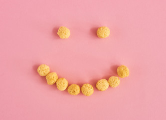 Cereals on pink background