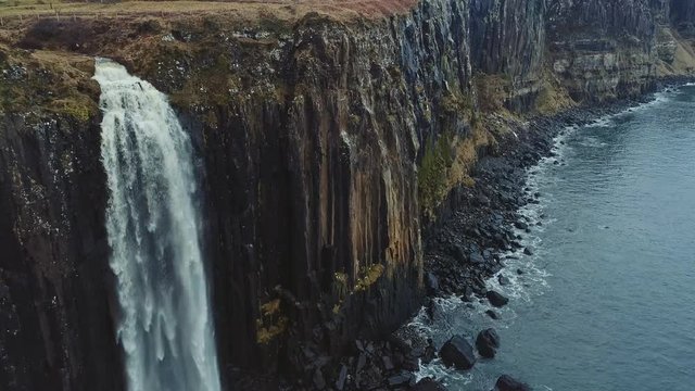 Aerial reveal of Kilt Rock and Mealt Falls from the Isle of Skye in Scotland, UK