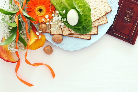 Pesah celebration concept (jewish Passover holiday). Traditional book with text in hebrew: Passover Haggadah (Passover Tale).