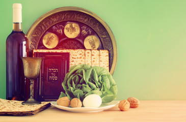 Pesah celebration concept (jewish Passover holiday). Traditional book with text in hebrew: Passover Haggadah (Passover Tale).