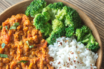 Bowl of red lentil curry with white rice and broccoli © alex9500