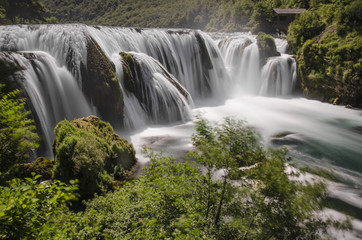 The bigest beautiful waterfall on Una river in national park in summer