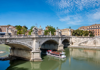 Obraz premium Ancient bridge above Tiber river in Rome, Italy.