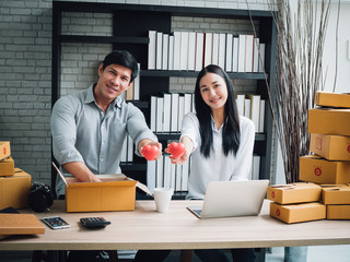 Couple working with laptop computer