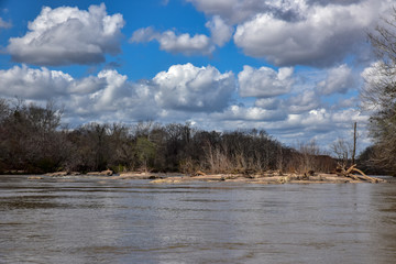 blue sky day on water with reflections