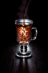 Tea making in a glass on a black background