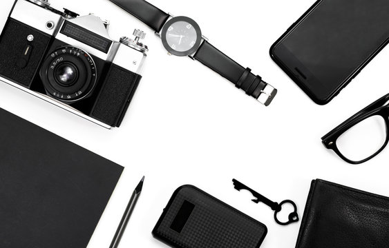 black clock, black pencil, black notepad, camera, black glasses, key, wallet on white background - Powered by Adobe