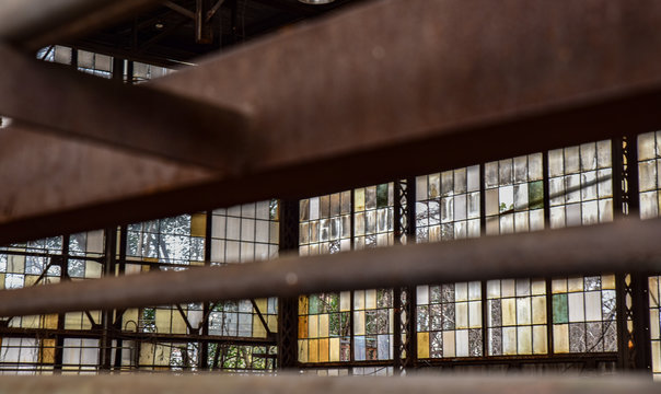 Broken windows in abandoned warehouse industrial space