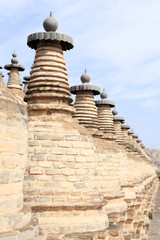The One Hundred and Eight Stupas is an array of one hundred and eight Buddhist stupas on a hillside on the west bank of the Yellow River at Qingtongxia in Ningxia, China.