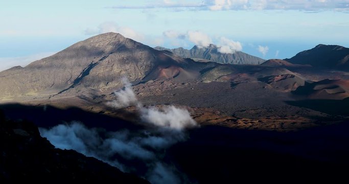 timelapse footage of clouds and shadows moving across the volcanic landscape of haleakala crater on the island of maui in hawaii in the pacific ocean