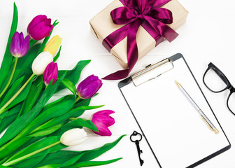 flowers and a gift on a white background