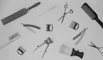 Vintage black and white photo with the tools of a hairdresser. In the photo there is fine grain.