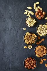 Assortment of nuts - healthy snack.Top view with copy space.