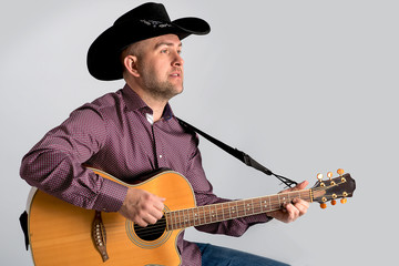 The man's portrait in a cowboy's hat.