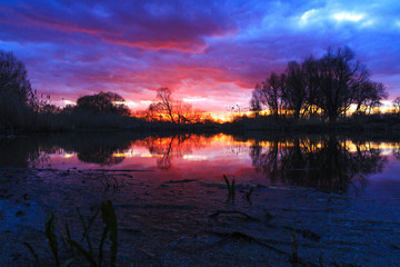 Fototapeta premium spring sunset above the lake