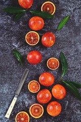 Juicy Blood Oranges on the dark background. Blood oranges isolated. Top view, flat lay