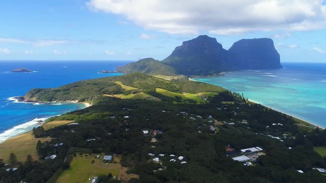 Aerial view of Lord Howe Island (World Heritage-listed paradise), turquoise blue lagoon and Mount Gower on background - New South Wales - Tasman Sea - Australia from above, 4k UHD