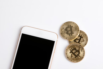 crypto currency, golden bitcoin and mobile phone on white background.
