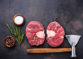 Raw meat osso buco and butchers axe