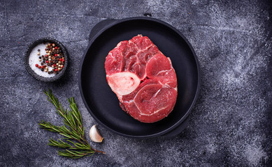 Raw meat osso buco with spices